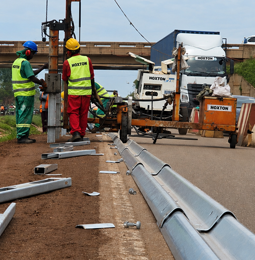 HES crew installing guardrail near an overpass